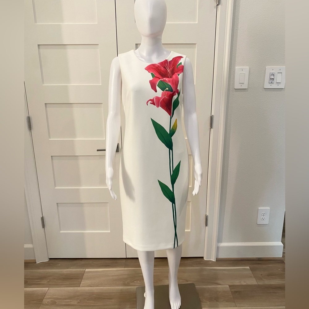 White Calvin Klein Floral Sheath Dress
Back zip
Size 8